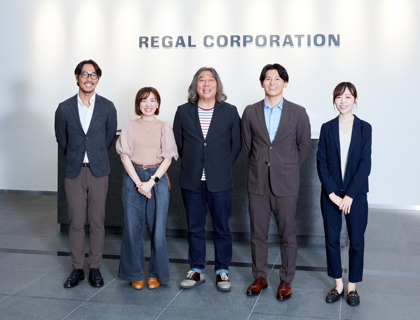 リーガルコーポレーション様とSpeee担当者の集合写真